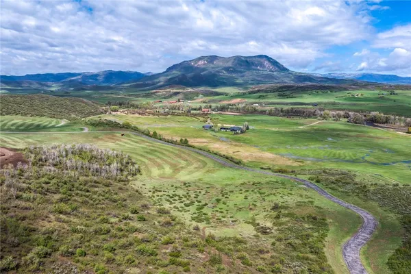a view of an ocean and a mountain