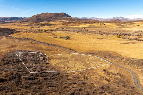 a view of an ocean and a mountain