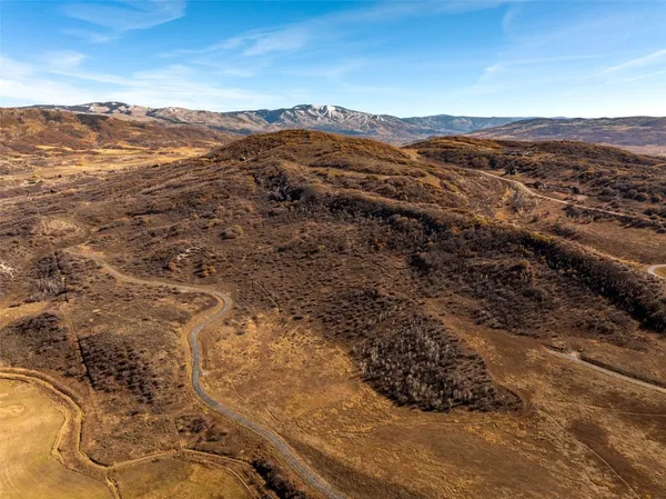 a view of an ocean and a mountain
