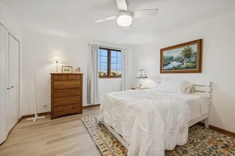 a bedroom with a bed and a cabinets