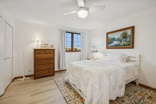 a bedroom with a bed and a cabinets