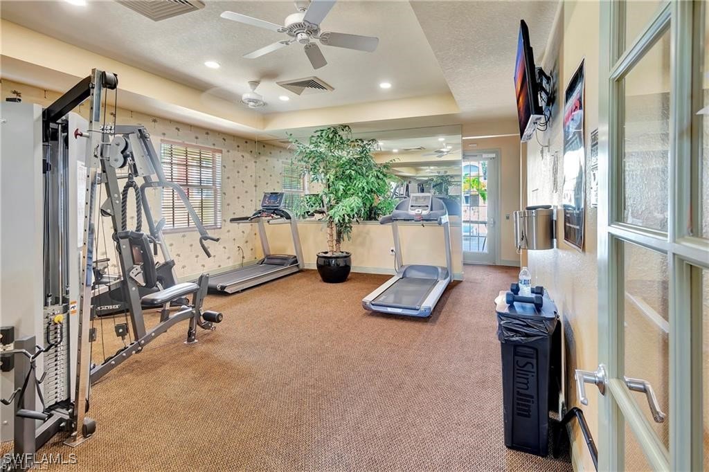 4109 Residence Drive, Unit 508 Fort Myers, FL 33901 - Photo 4 of 10 a view of hall way with furniture and gym equipment