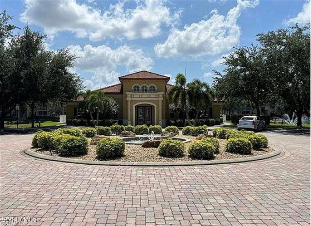 4109 Residence Drive, Unit 508 Fort Myers, FL 33901 - Photo 5 of 10 a view of a house with a garden