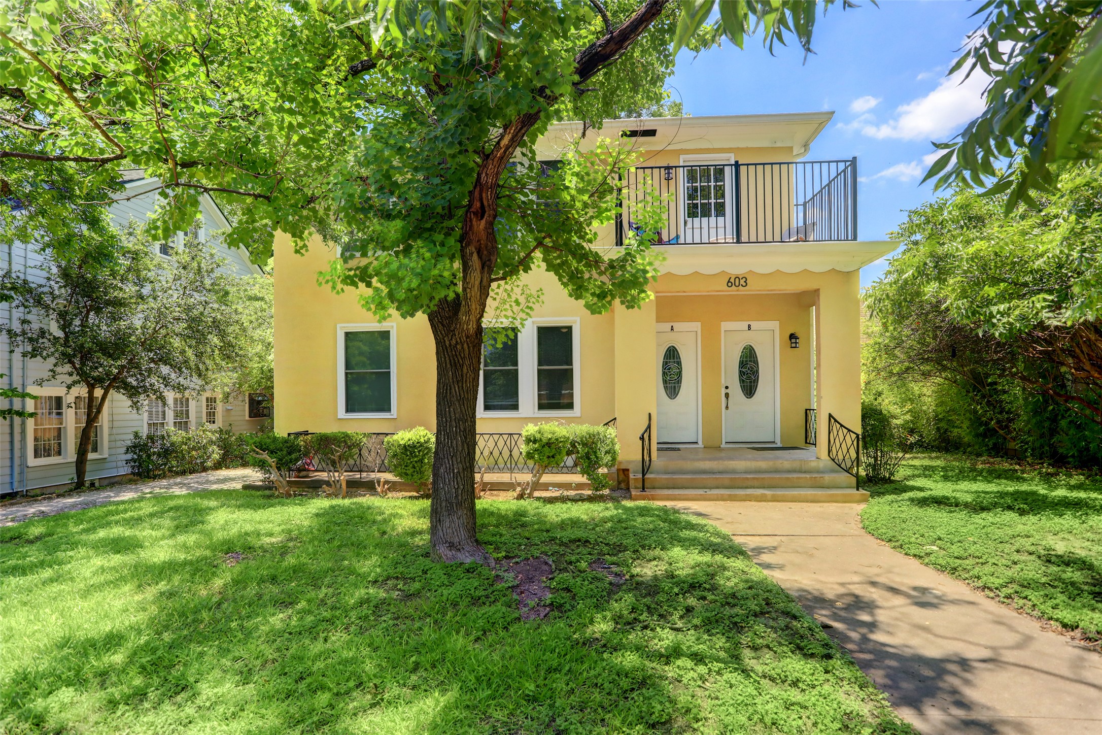 603 Bellevue Place, Unit B Austin, TX 78705 - Photo 1 of 22 a front view of house with yard and green space