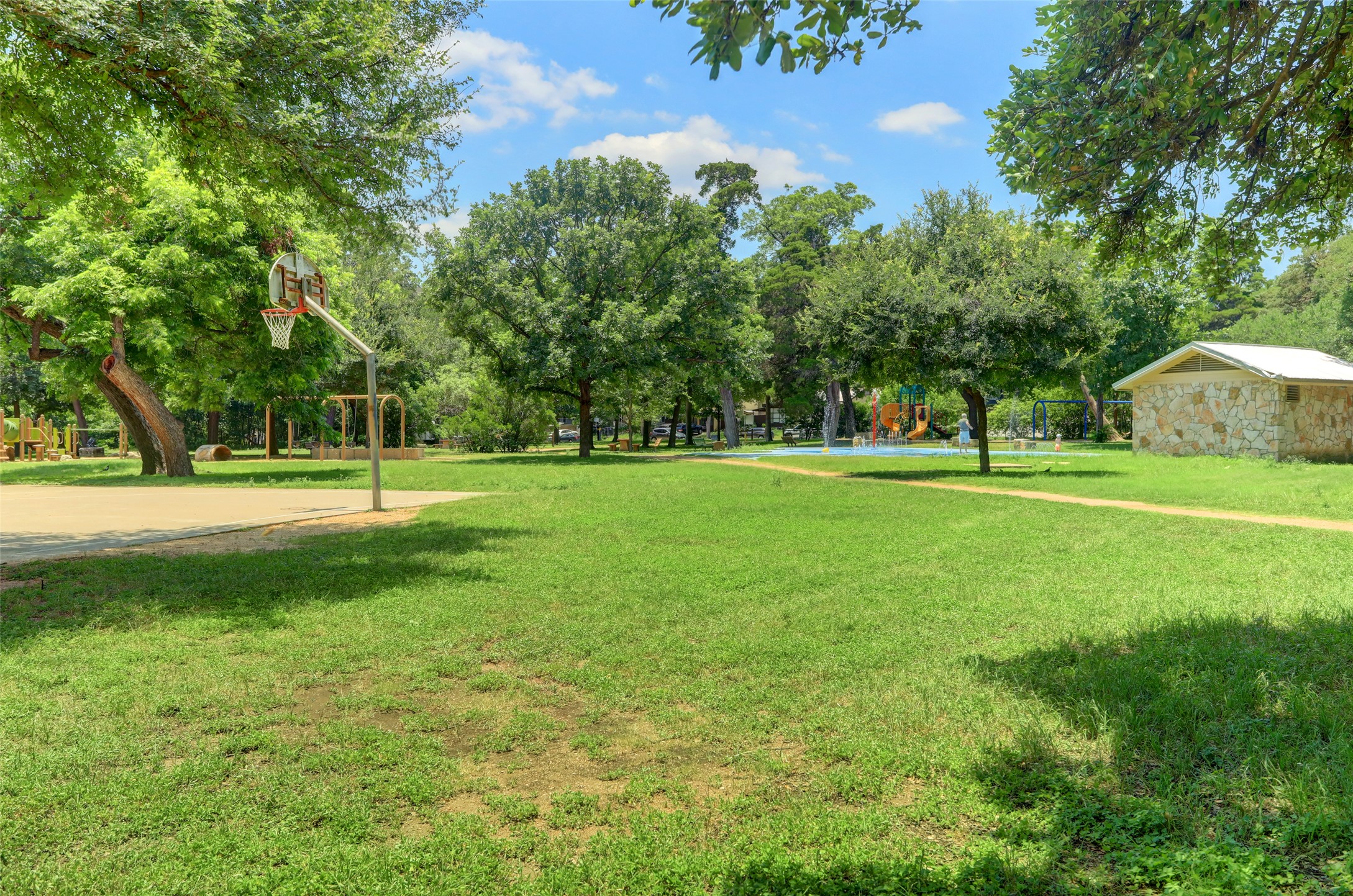 603 Bellevue Place, Unit B Austin, TX 78705 - Photo 20 of 22 a view of a grassy field with trees
