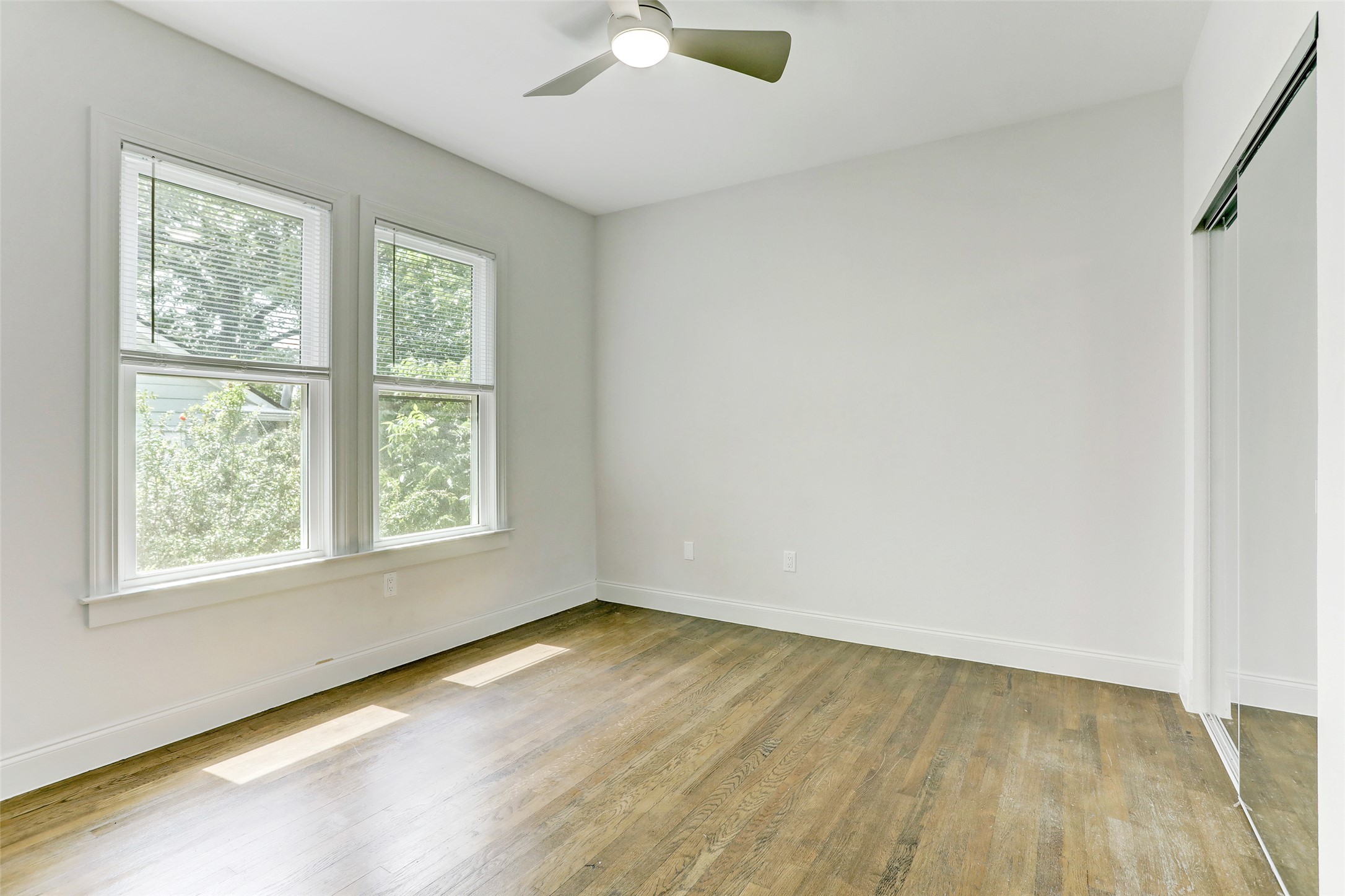603 Bellevue Place, Unit B Austin, TX 78705 - Photo 9 of 22 an empty room with a window