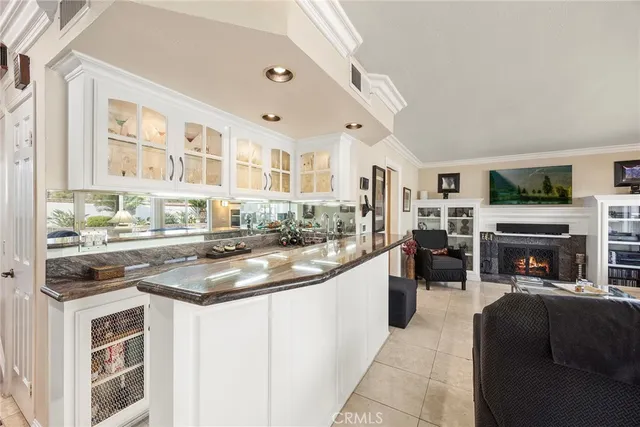 a kitchen with stainless steel appliances granite countertop a sink and cabinets