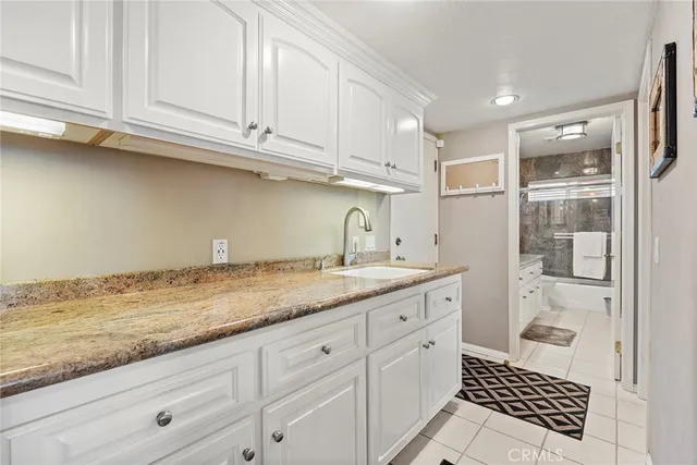 a kitchen with a sink and cabinets