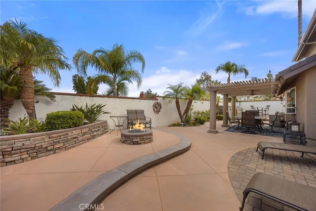 a view of a house with outdoor space and sitting area