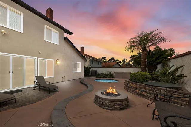 a front view of a house with sitting area