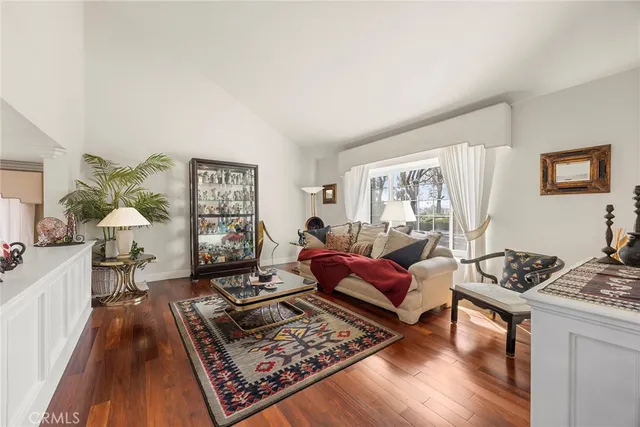 a living room with furniture and a rug