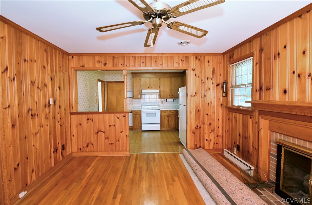 751 Courthouse Road North Chesterfield, VA 23236 - Photo 14 of 37 a view of a livingroom with wooden floor and a ceiling fan