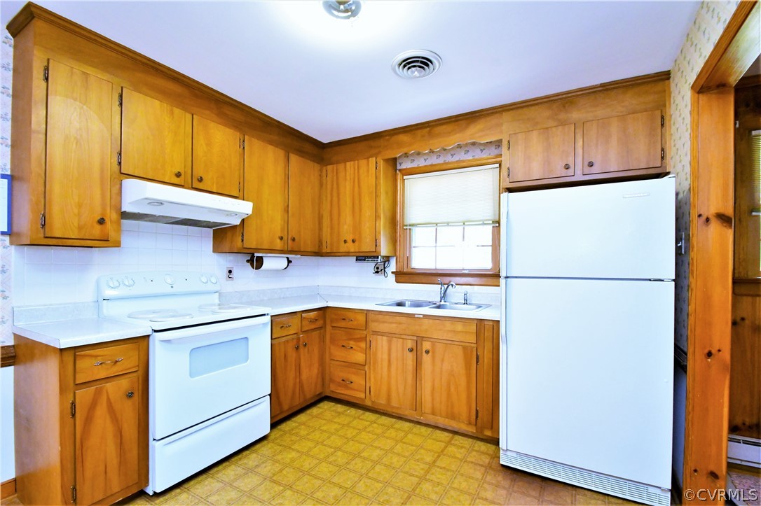 751 Courthouse Road North Chesterfield, VA 23236 - Photo 16 of 37 a kitchen with stainless steel appliances granite countertop a refrigerator a sink dishwasher and wooden cabinets