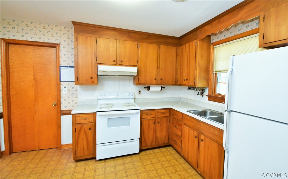 751 Courthouse Road North Chesterfield, VA 23236 - Photo 17 of 37 a kitchen with stainless steel appliances granite countertop a sink and a refrigerator