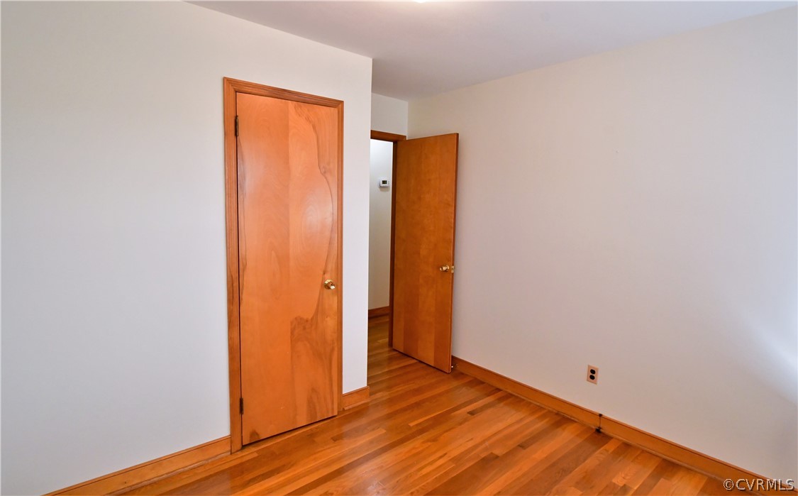 751 Courthouse Road North Chesterfield, VA 23236 - Photo 20 of 37 a view of an empty room with wooden floor and a window