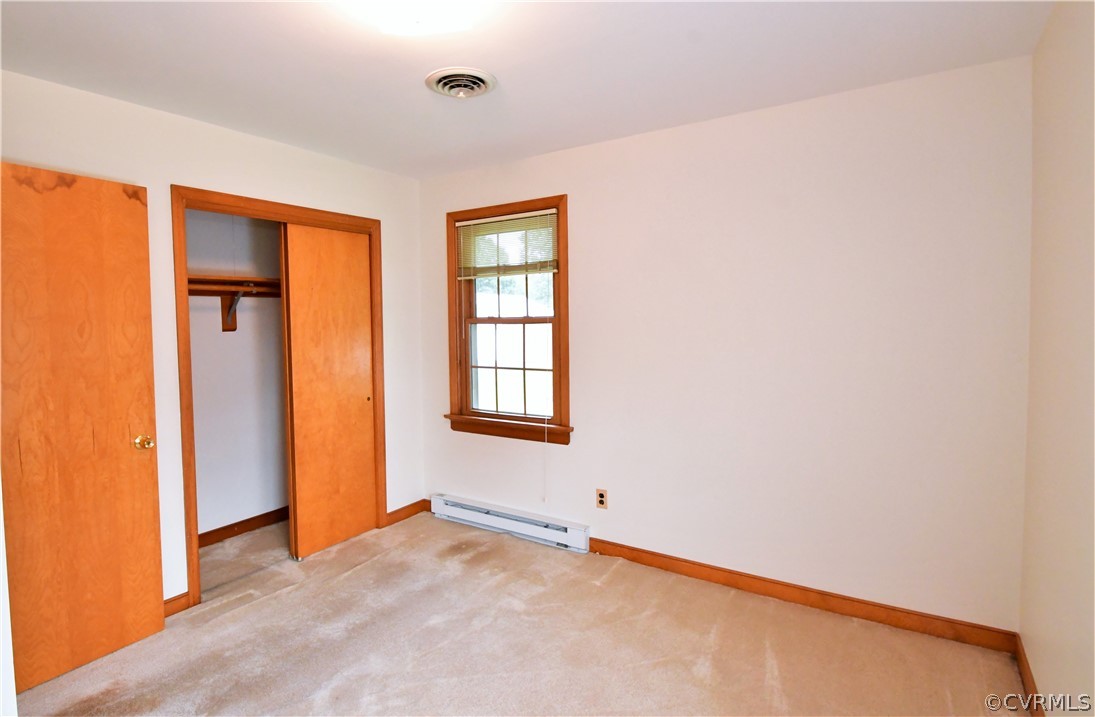 751 Courthouse Road North Chesterfield, VA 23236 - Photo 24 of 37 an empty room with windows and closet