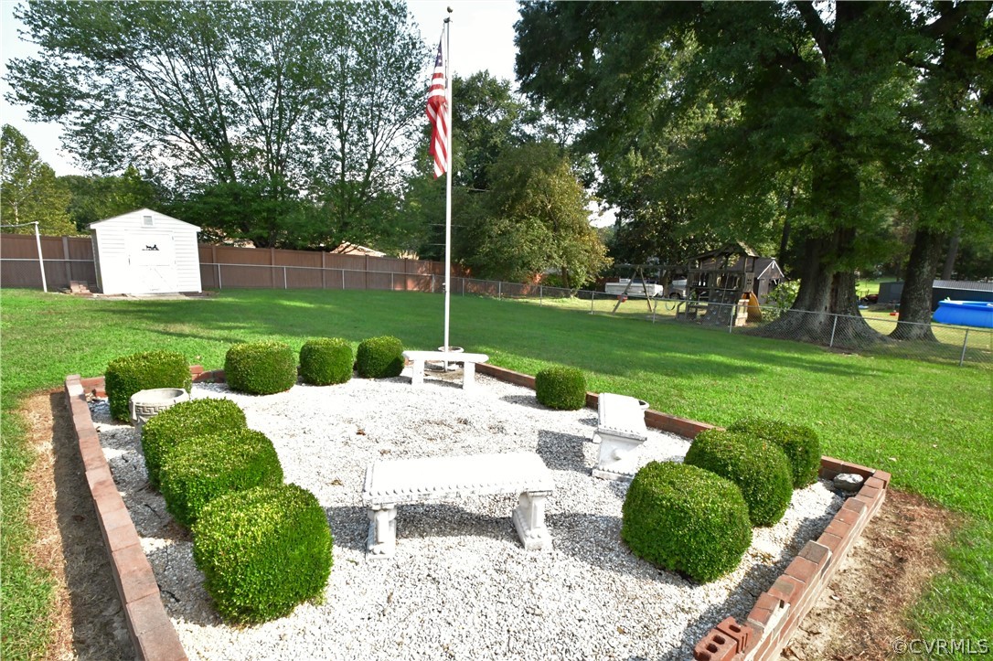 751 Courthouse Road North Chesterfield, VA 23236 - Photo 29 of 37 a view of a house with a backyard and a patio