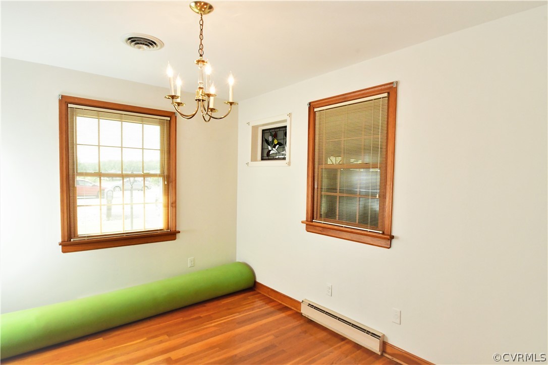 751 Courthouse Road North Chesterfield, VA 23236 - Photo 8 of 37 a view of a room with wooden floor chandelier and windows