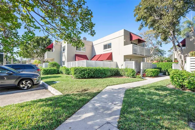 a view of a car in front of a house