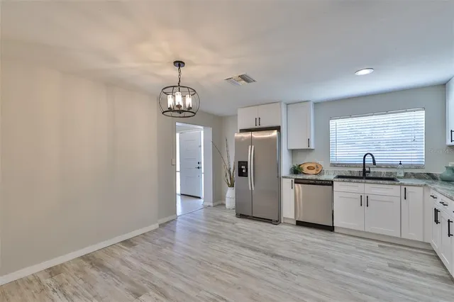 a view of livingroom with hardwood floor and ceiling fan