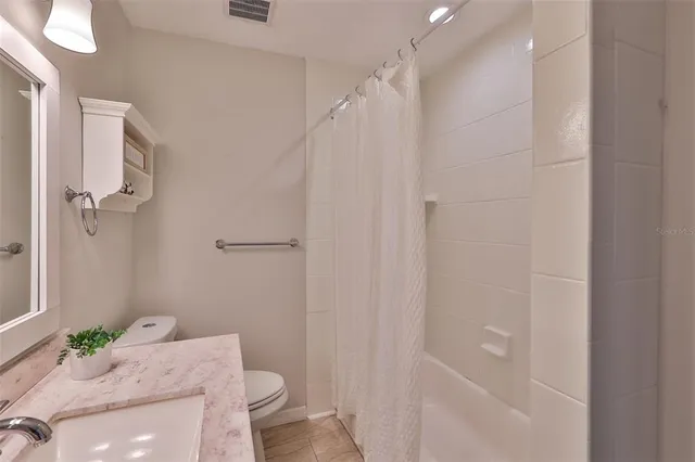 an empty room with wooden floor and a window