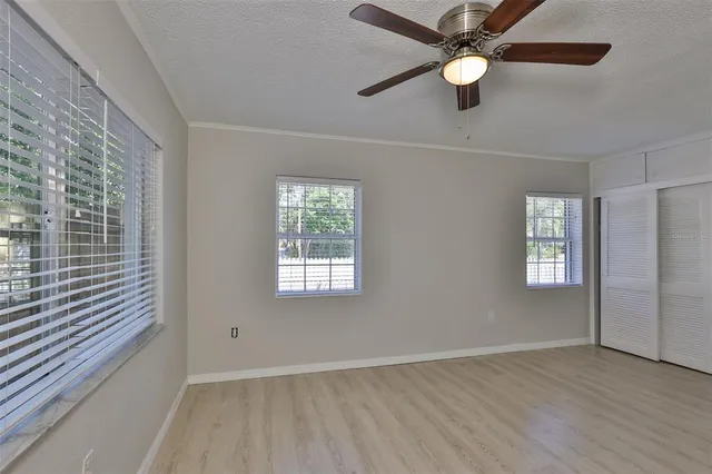 a kitchen with granite countertop a sink stainless steel appliances and cabinets