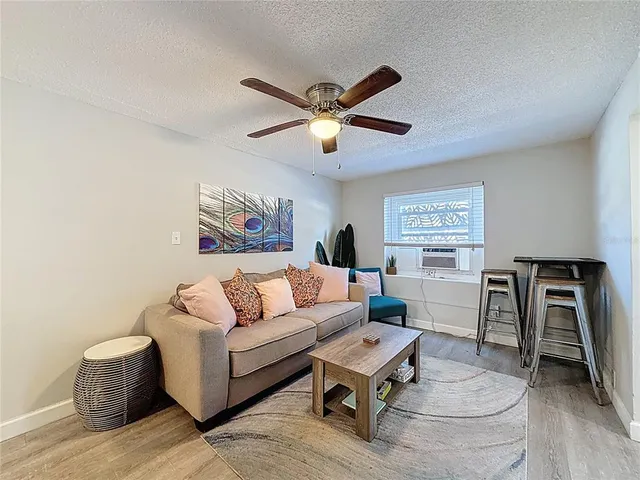 a white toilet sitting next to a bath tub