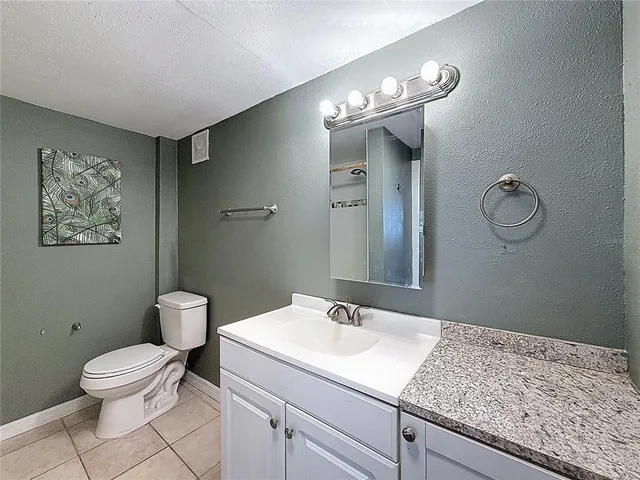a view of a hallway with wooden floor and a hallway