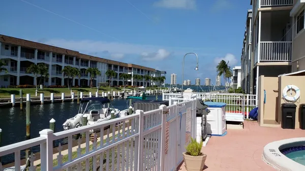 a balcony with outdoor seating and city view