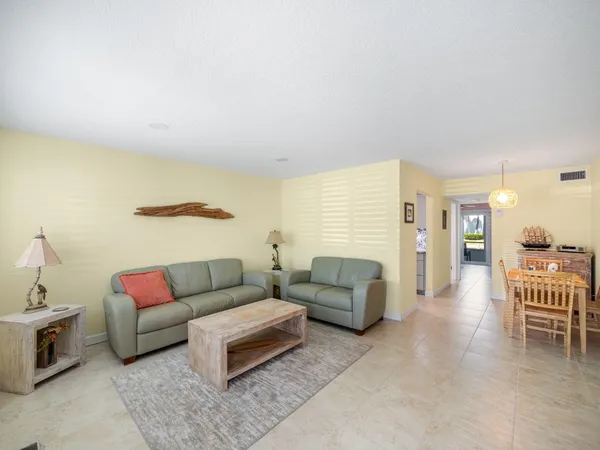 a living room with furniture and a couch