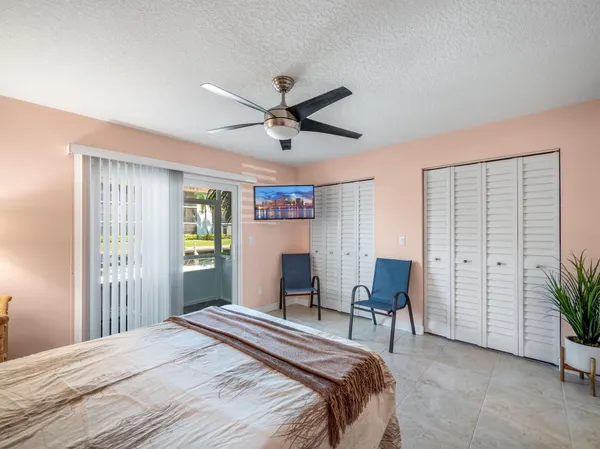 a bedroom with a bed and a table in it