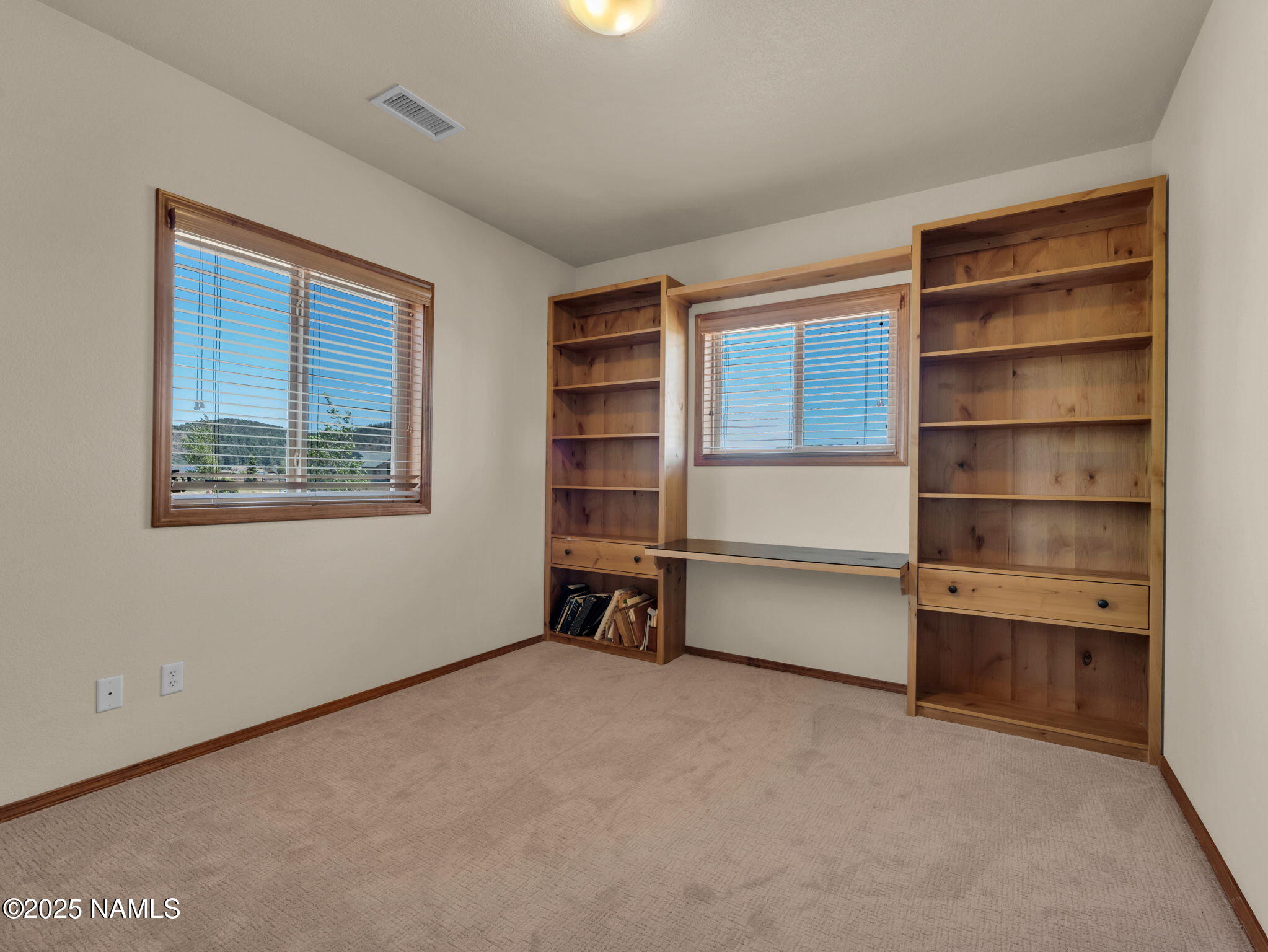9644 North Bryant Road Flagstaff, AZ 86004 - Photo 23 of 54 2nd Bedroom with built-in shelving