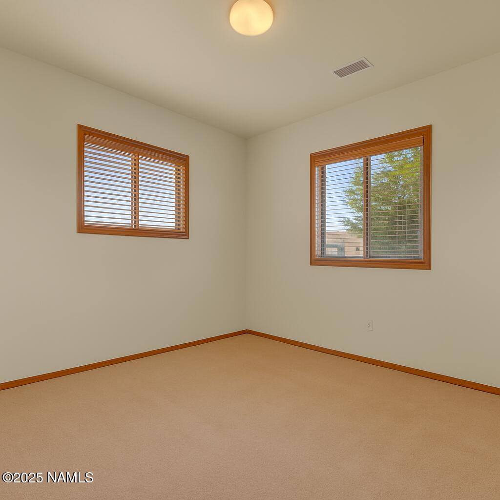 9644 North Bryant Road Flagstaff, AZ 86004 - Photo 26 of 54 a view of an empty room with a window