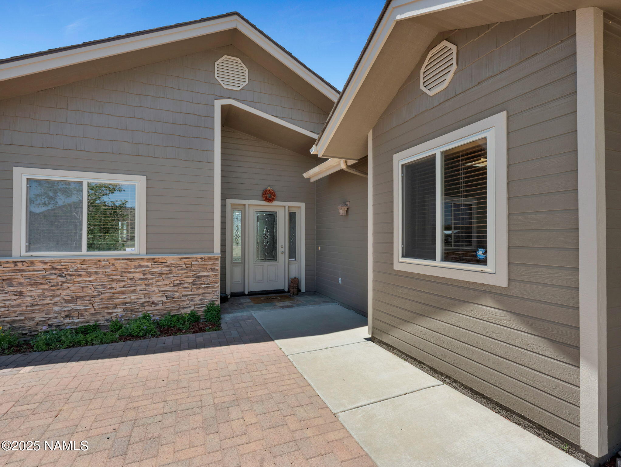 9644 North Bryant Road Flagstaff, AZ 86004 - Photo 54 of 54 a front view of a house with a yard