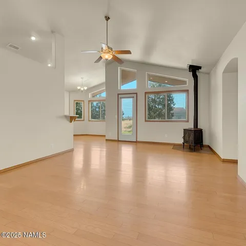 a view of a house with a small yard and potted plants
