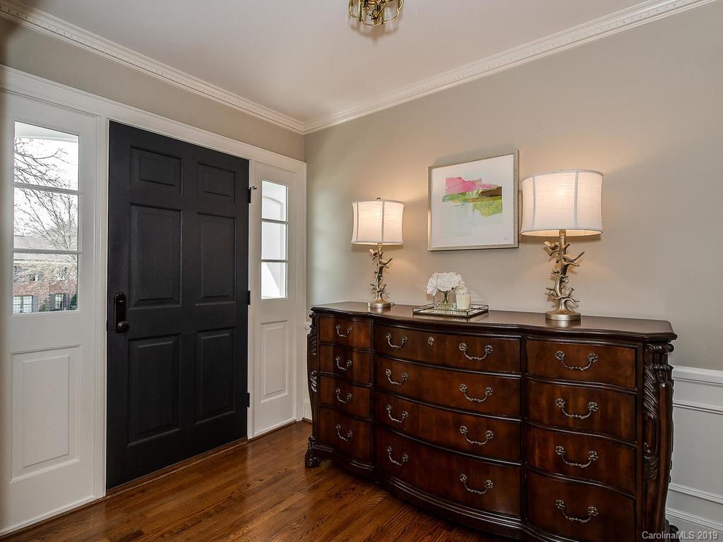 3108 Wickersham Road Charlotte, NC 28211 - Photo 3 of 34 a room with a dresser and a mirror