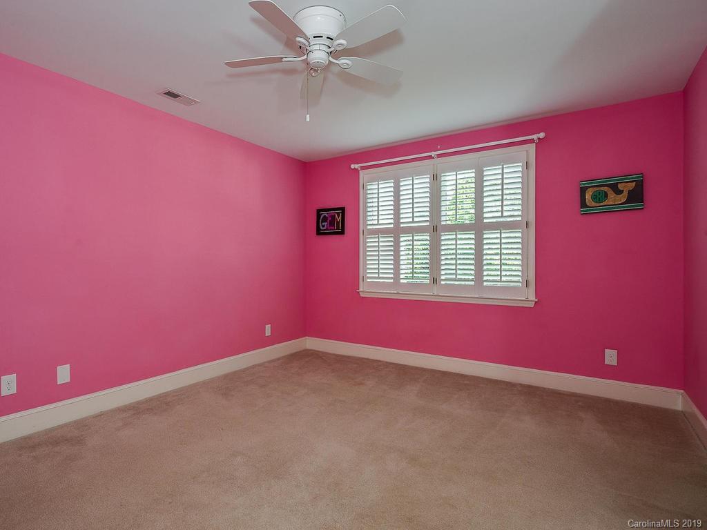 3108 Wickersham Road Charlotte, NC 28211 - Photo 22 of 34 an empty room with windows and fan