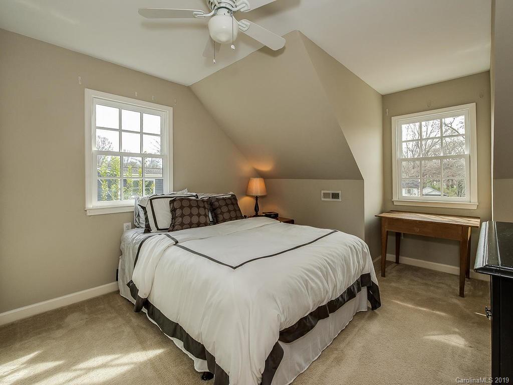 3108 Wickersham Road Charlotte, NC 28211 - Photo 33 of 34 a bedroom with a bed and a window