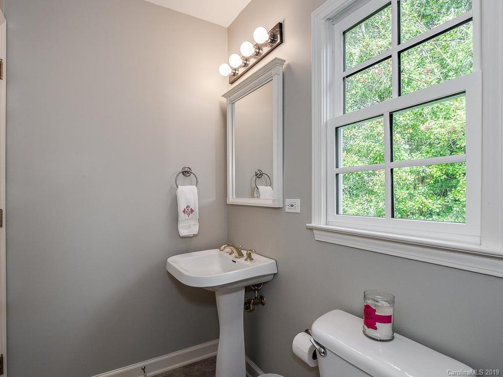 3108 Wickersham Road Charlotte, NC 28211 - Photo 34 of 34 a bathroom with a sink toilet and a mirror