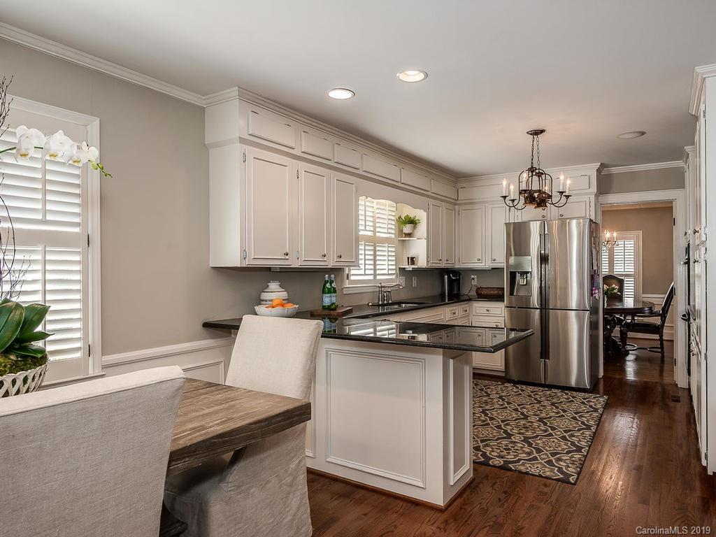 3108 Wickersham Road Charlotte, NC 28211 - Photo 8 of 34 a kitchen with a stove and a refrigerator