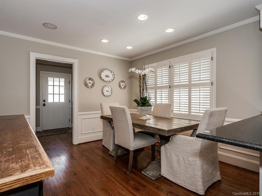 3108 Wickersham Road Charlotte, NC 28211 - Photo 9 of 34 a view of a dining room with furniture and wooden floor