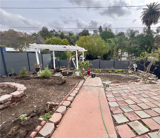 a view of a backyard with sitting area