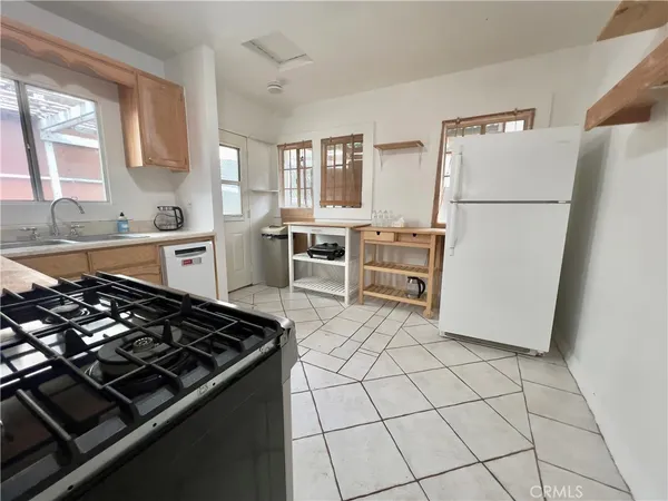 a kitchen with stainless steel appliances a stove and a refrigerator