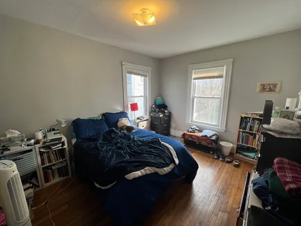a bed room with furniture and a window