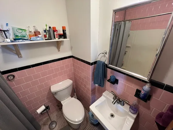 a bathroom with a toilet and a sink