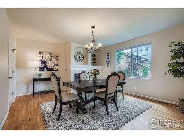 a dining room with furniture and window