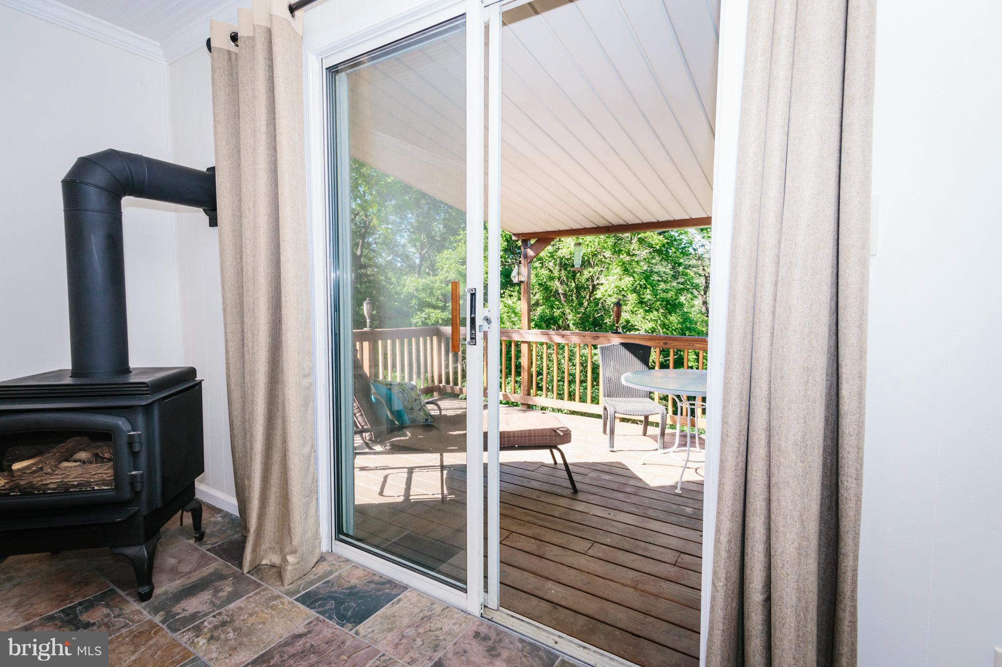 2056 Flag Marsh Road Mount Airy, MD 21771 - Photo 6 of 26 Cozy gas FP slate entry to deck w view of preserve
