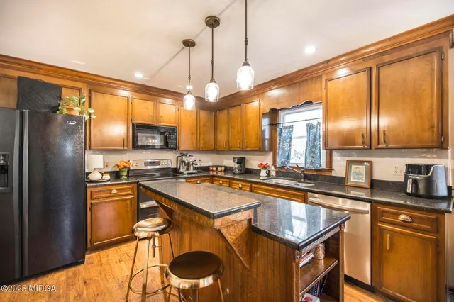a spacious bedroom with a bed and a table in it