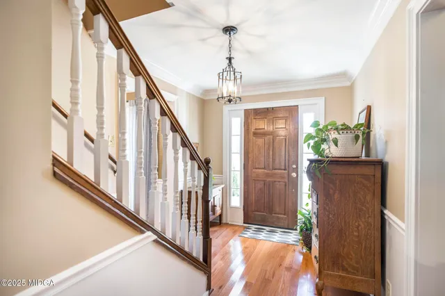 a kitchen with stainless steel appliances granite countertop a sink a stove and refrigerator