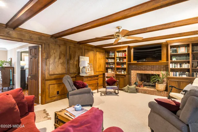 a view of a kitchen with fridge and wooden floor